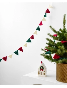 Detail of red, green and white wool felt bunting banner for Christmas home decor