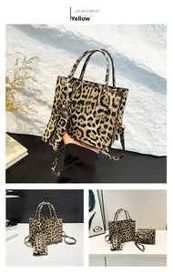 Detail view of leopard print tote bag with small pouch showing texture and reinforced handles
