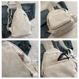 Detail of white marble textured multi-functional chest bag showing storage for daily items