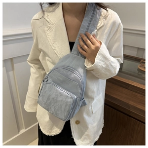 Fashionable light blue pleated chest bag with multi-layer zipper pockets for women