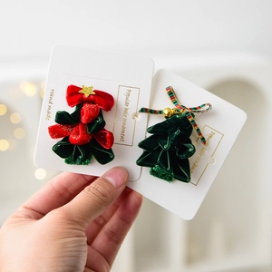 Christmas velvet reindeer antler headbands with stars and bells shown in hand