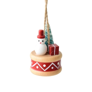 Handcrafted wooden Christmas ornament with mini snowman and tree on a decorated base