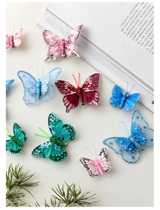 Detailed view of colorful glitter and mesh butterfly clips for Christmas tree decoration