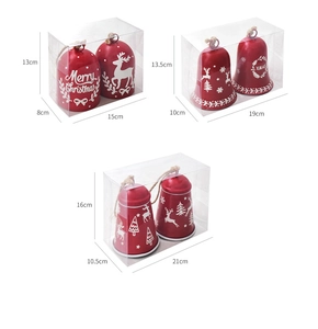 Three sizes of red metal Christmas bells in packaging boxes with festive reindeer prints