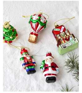Detailed view of hand-painted glass Christmas ornaments on a soft snowy background