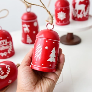 Red Christmas iron bells with white reindeer prints and jute ropes for holiday tree decor