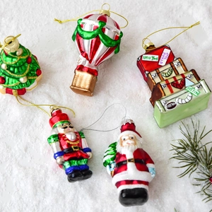 5-piece painted glass Christmas ornaments set featuring Santa Nutcracker and travel trunks