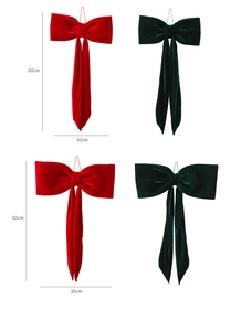 Dettaglio di fiocchi natalizi in velluto rosso e verde da 60 cm con texture felpata