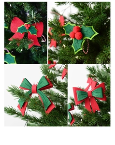 Detail of felt Christmas bow ornaments with holly berries on a festive Xmas tree