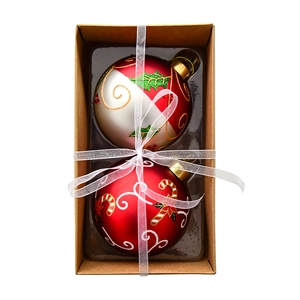 Christmas glass ball ornaments set with candy cane and holly leaf designs in a gift box