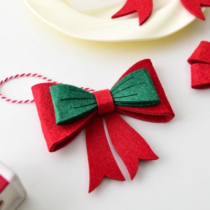 Christmas bow ornament in red and green felt with cotton rope for tree decoration