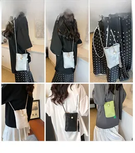 Mini crossbody phone bag with pearl button and tassel fringe shown in various colors