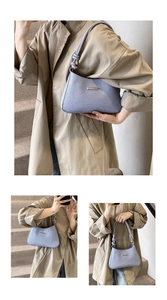Detailed views of a light blue textured underarm bag with gold logo and knotted strap