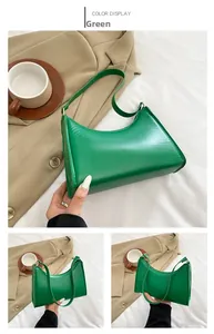 Detail view of the green smooth PU leather crescent underarm bag with zipper closure