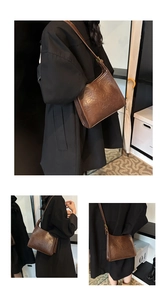 Detail view of a large dark brown retro tote bag with smooth oil-wax leather texture