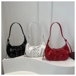 Detailed comparison of pleated hobo bags in black, ivory, and red with ribbon lacing