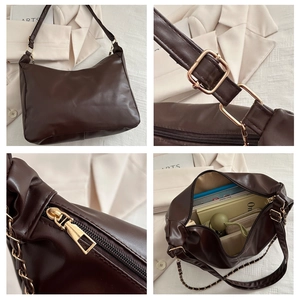 Detail view of coffee PU leather tote showing adjustable strap, zipper, and large capacity