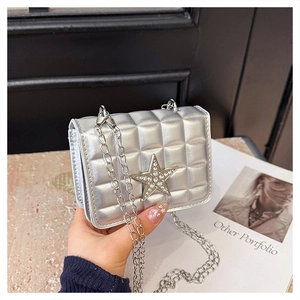 Detail of silver metallic square pattern bag with rhinestone star and chain strap