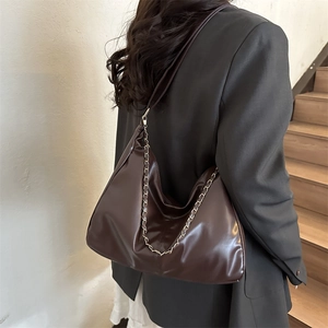 Retro dark coffee brown PU leather tote bag with gold chain strap on model