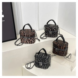Collection of leopard print box bags in four colors with chain straps and top handles