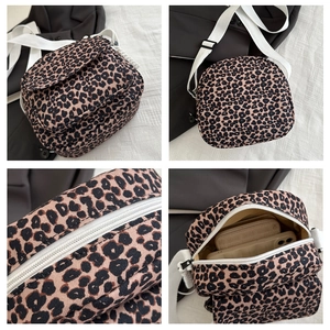 Detailed views of leopard print crossbody bag showing zipper, strap, and interior capacity