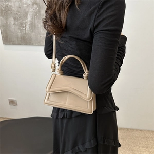 Minimalist apricot square handbag with wavy flap and knot handle for women fashion
