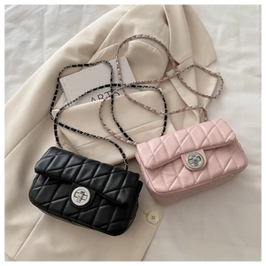 Close-up of quilted chain crossbody bags in black and pink with metal turn-lock