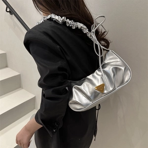 Chic silver pleated hobo shoulder bag with a metallic finish and Y2K aesthetic