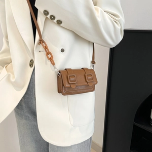 Mini brown PU leather crossbody bag with chain strap and dual buckle flip cover
