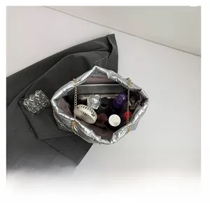 Internal view of silver quilted tote bag showing large capacity for essentials