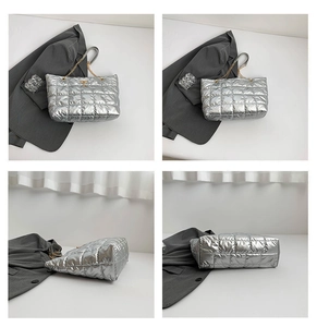 Detailed views of silver quilted tote bag featuring metallic finish and gold chain straps