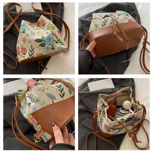Detail of floral ethnic bucket bag showing the large capacity for umbrella and phone