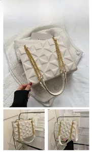Detail of cream-colored chain shoulder bag featuring modern 3D diamond quilted texture