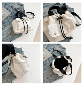 Detail shots of the white nylon bucket bag showing drawstring, strap, and large interior capacity