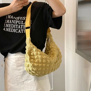 Fashionable bright yellow bubble textured hobo bag with adjustable wide fabric shoulder strap