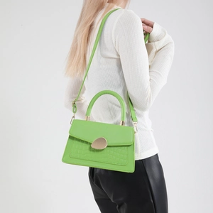 Chic light green crossbody square bag with crocodile embossing and golden twist lock