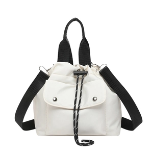 Contrast nylon shoulder bag with black webbing straps and drawstring pocket