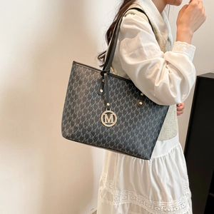 Large black tote bag with M-letter monogram print and gold metallic charm for women
