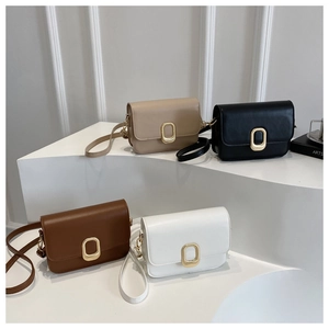 Detailed view of the structured square bag collection with elegant gold metallic buckles