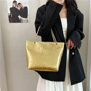 Chic gold crocodile embossed leather tote bag with elegant chain shoulder straps for women