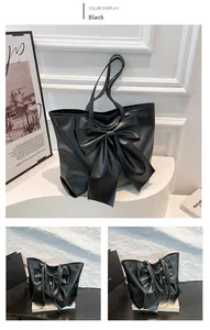 Détail du grand nœud décoratif sur un sac cabas en cuir noir avec bandoulière élégante