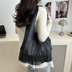 Fashionable black faux leather hobo bag with tiered fringe detail for women