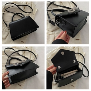 Detailed interior view and front of black crossbody bag with rhinestone bow decoration