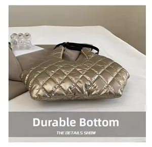 Detailed view of the wear-resistant bottom and quilted gold fabric of the tote bag