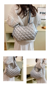 Detail of silver quilted tote bag showing padded texture and spacious side profile