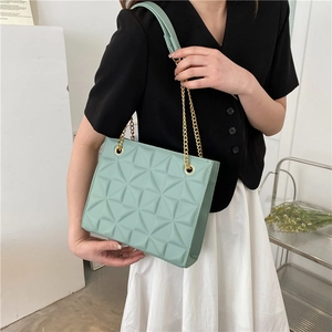 Mint green crossbody bag with geometric diamond quilting and gold chain strap