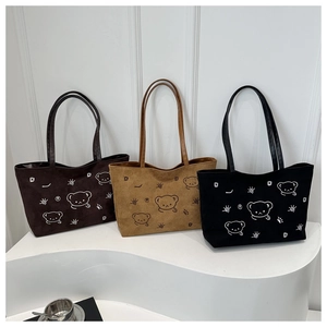 Three suede tote bags in coffee, khaki, and black featuring cute bear patterns