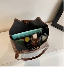 Detail view of large capacity oil wax leather tote bag showing spacious interior and storage