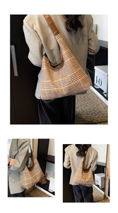 Detail of vintage plaid tote bag featuring thick wool fabric and brown leather strap
