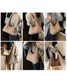 Model wearing check pattern hobo bag showing shoulder carry style and large capacity